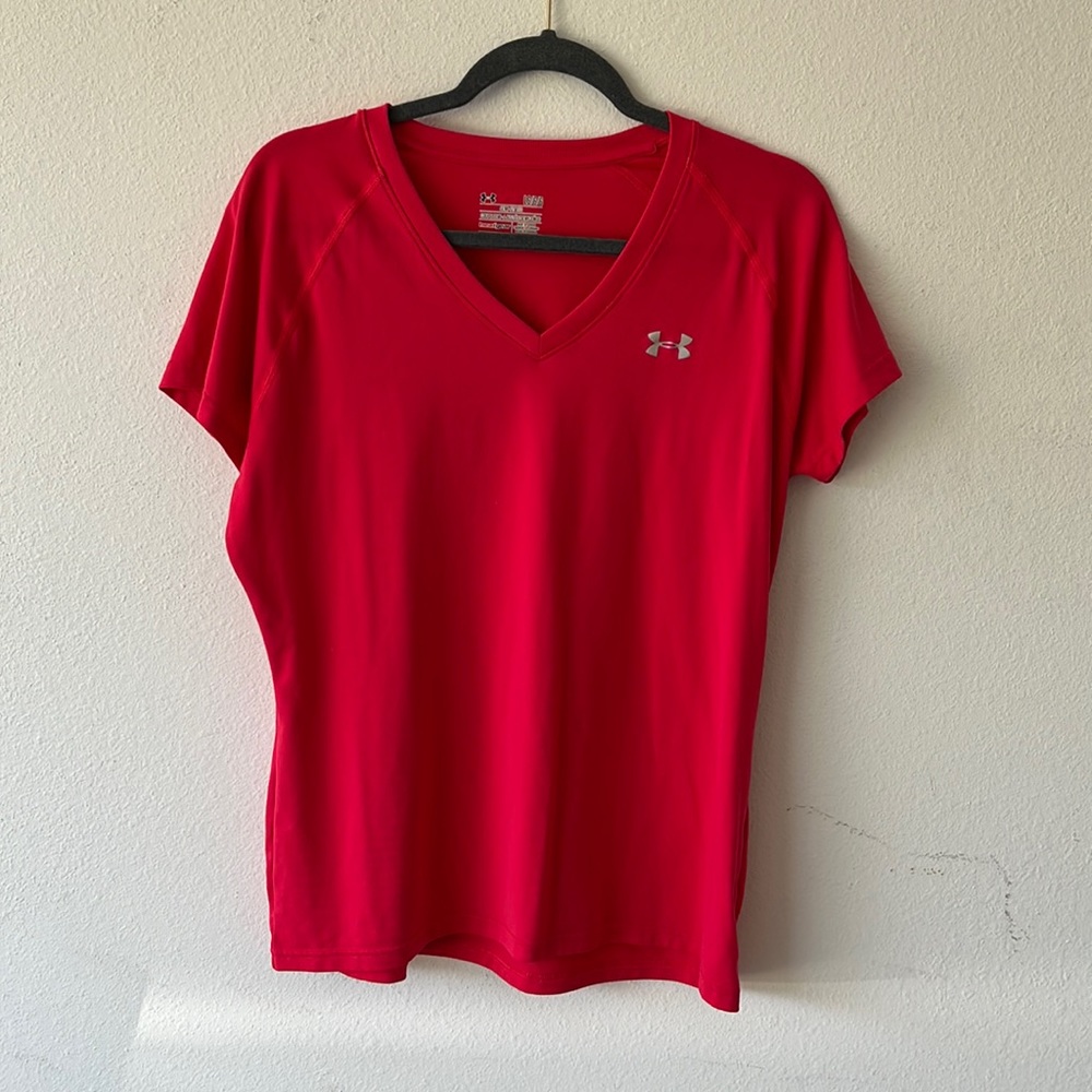 Hot pink Under Armour semi-fitted athletic heat gear shirt in size large.
